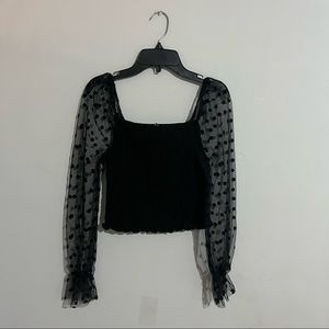 Black crop top with sheer polka dot sleeves